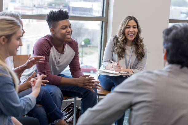 istock Diverse group laughs when unseen person tells a joke 1158890188