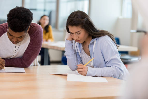 istock Teen students focus on science test 1158890234