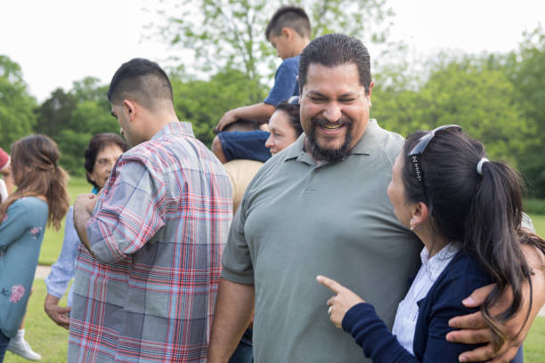 istock Couple talk during family reunion 1158890282