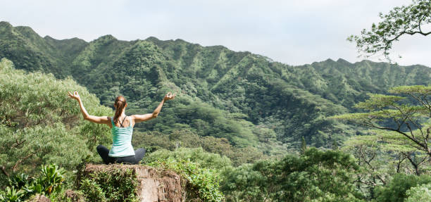 Woman meditating in a beautiful nature setting