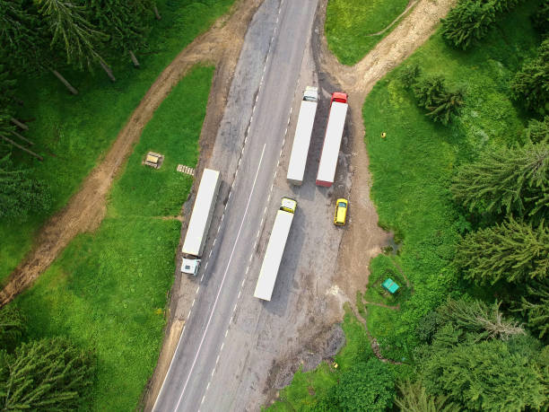 istock trucks in a paking in the forest. 1158891131