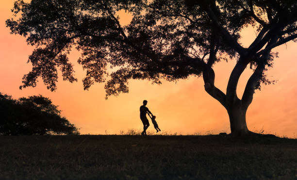 istock Father and son playing in the park. 1158891217