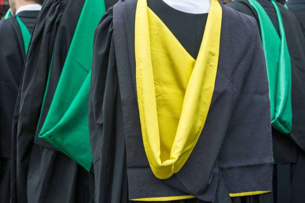 istock Close up of graduation gowns 1158892433