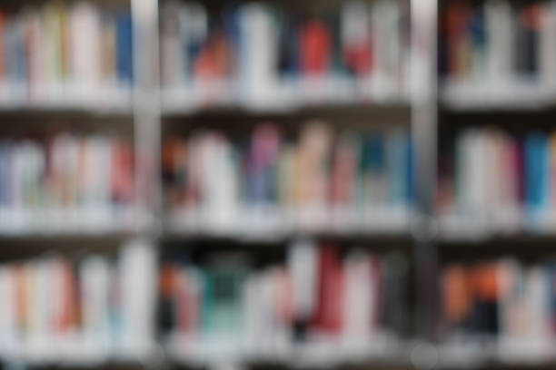 istock Blur image of shelf with books in library. Background. 1158895375