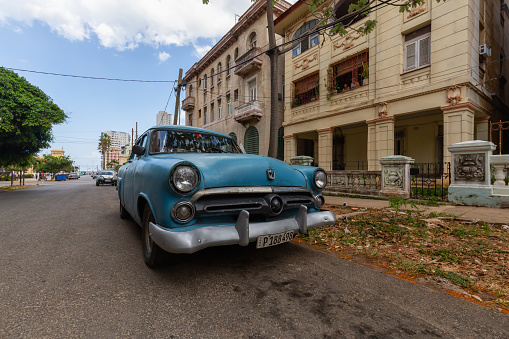 Havana, Cuba - May 14, 2019: Classic Old Car in the streets of the Old Havana City during a vibrant and bright sunny morning.