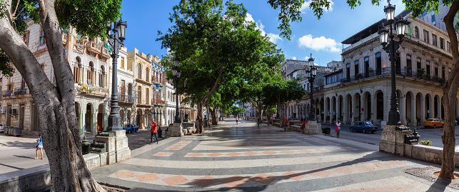 Havana, Cuba - May 13, 2019: Beautiful Panoramic Street view of the Old Havana City, Capital of Cuba, during a bright and sunny morning.