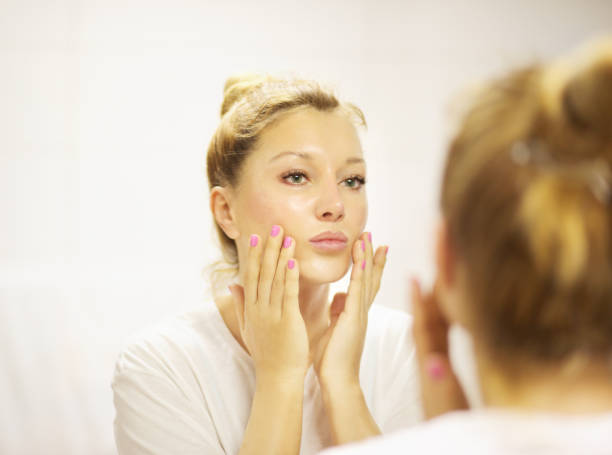 istock Magic anti-aging cream.Applying the cream 1158901953