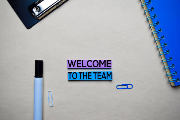istock Welcome to the Team text on sticky notes with office desk concept 1158906617
