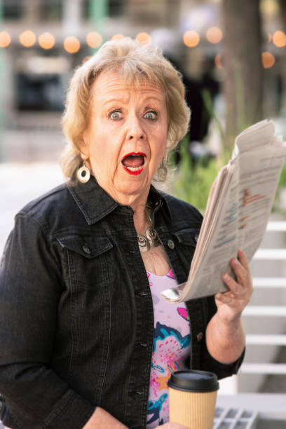 istock Womn Reacting to Newspaper Story 1158906647