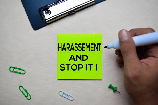 istock Harassement and Stop it! text on sticky notes with office desk concept 1158906756