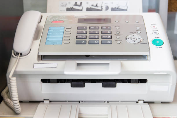 istock a fax machine in the office Business concept 1158910934