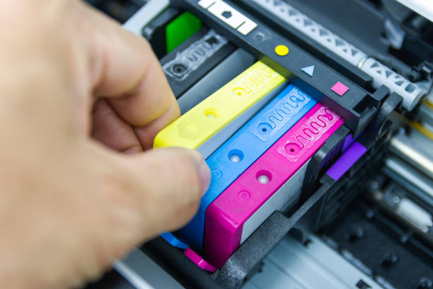 istock Technicians are installing the color printer inkjet cartridge of the printer 1158911001