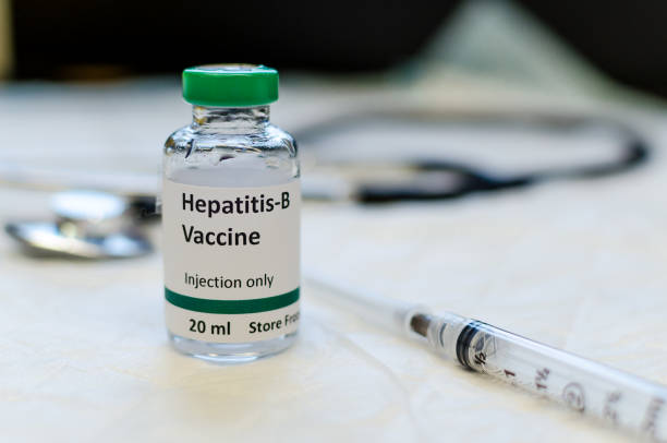 Hepatitis B vaccine vial Fake hepatitis B vaccine vial with syringe and stethoscope at the background hepatitis photos stock pictures, royalty-free photos & images