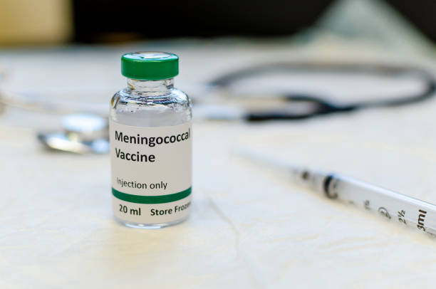 istock Meningococcal vaccine vial with syringe and stethoscope 1158911646