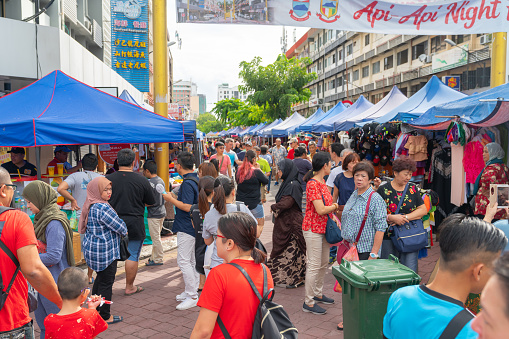 Kota Kinabalu Gaya Street Sunday market  people throng between the stalls and vendors June
 2019 Sabah, Borneo