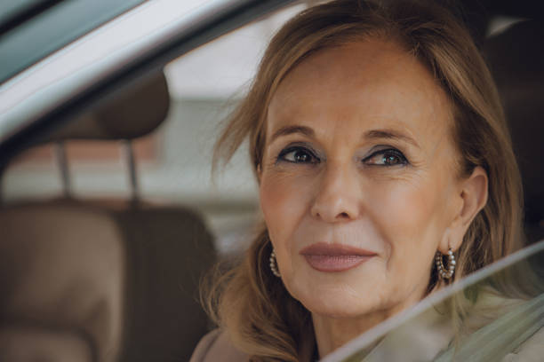 istock Senior female driving 1158913378