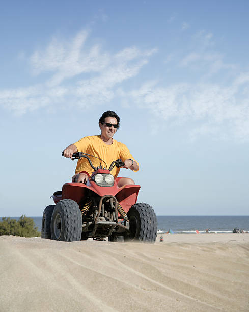 istock Fourwheeler in the sand 115891493