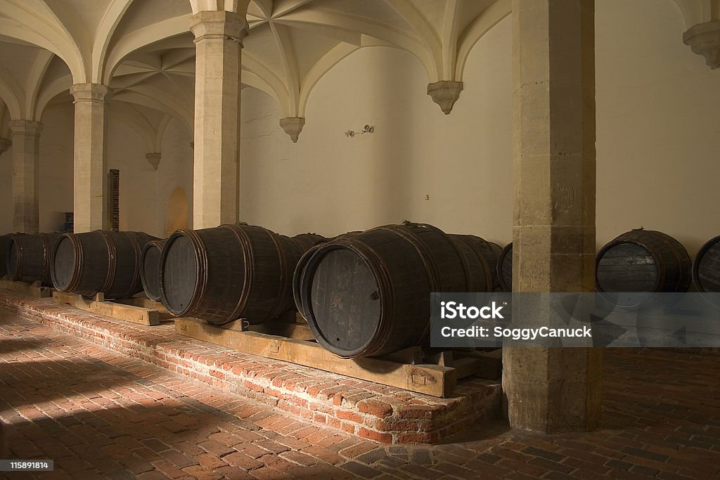 Wine casks in cellar A collection of old wooden wine casks in cellar Aging Process Stock Photo