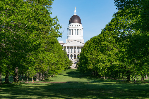 Facade of the Maine State Capitol Building from Capitol Park in Augusta, Maine
