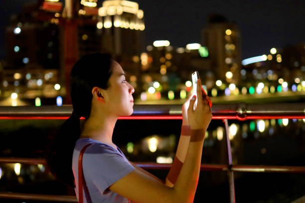istock Young woman walking at raibow bridge 1158944136