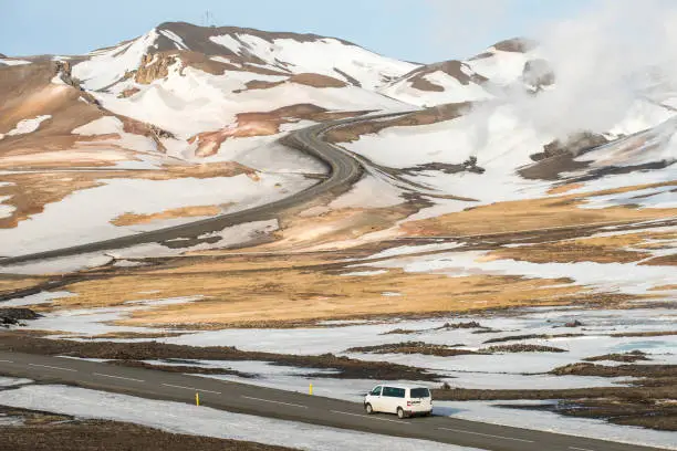 Photo of Car driving on the ring road pass the landscape in North Iceland.
