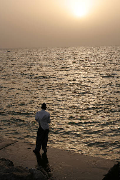 istock man stand by the sea 115894881