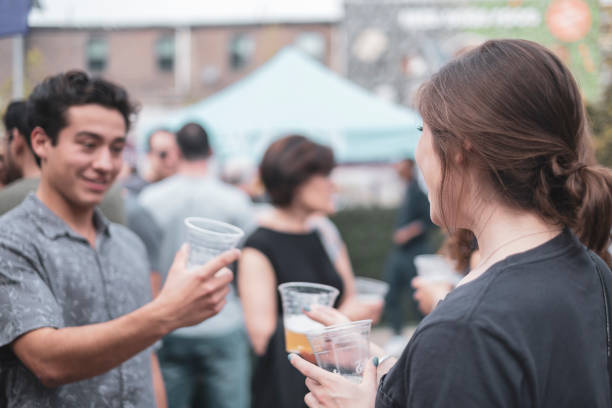 Boyfriend and girlfriend outside drinking