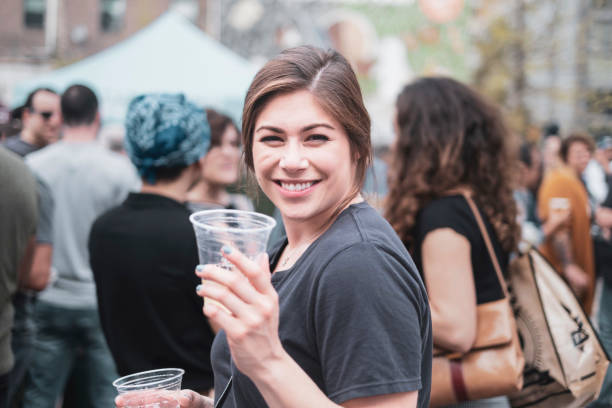 istock Woman drinking beer outside 1158952018
