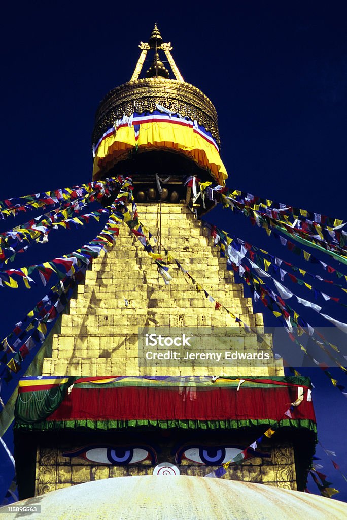 Bodhnath Stupa, Nepal Bodhnath is the largest stupa in Nepal and the de facto religious centre of Nepal\'s large Tibetan community.  The association is because the site marked the Tibetan trade route entrance to Kathmandu. Ancient Stock Photo