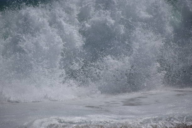 istock Big Shore Break Wave Crashing Foam and Spray 1158956133
