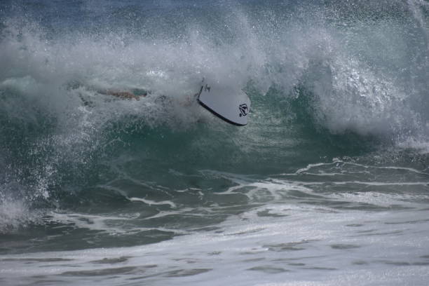 istock Big Shore Break Wave Crashing with Boogie Boarder 1158956145