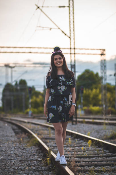 istock Single Girl Walking on Railway 1158957062