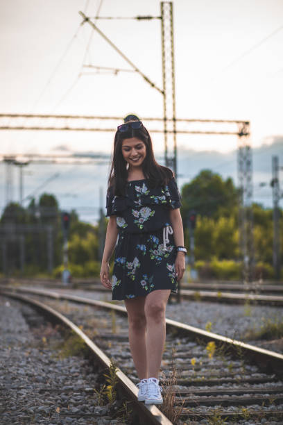 istock Single Girl Walking on Railway 1158957090