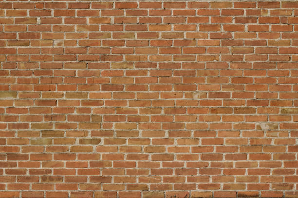 istock Antique reddish brown brick wall background in traditional running bond pattern 1158958520