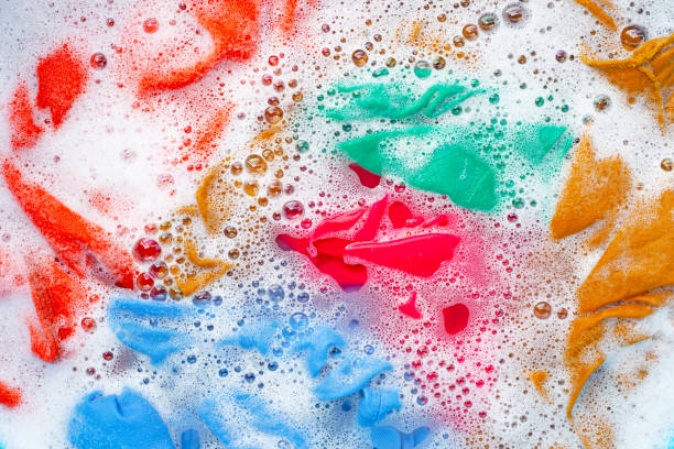 istock Color clothes soak before washing. 1158967569
