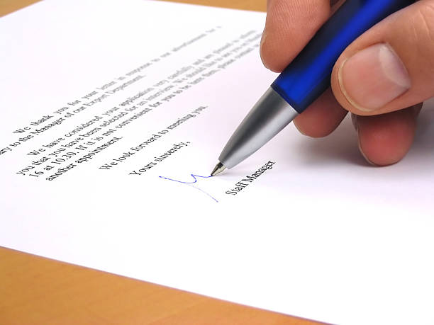 istock Staff manager signing a letter 115896844