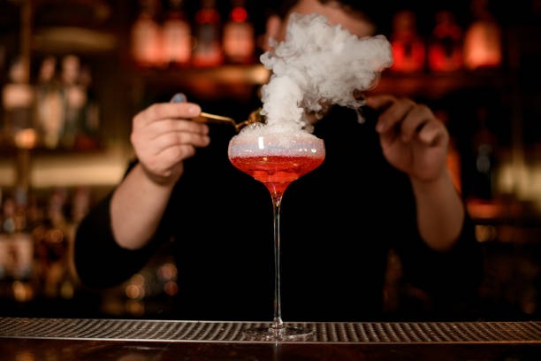 istock Bartender puts foam in an alcohol drink 1158970692