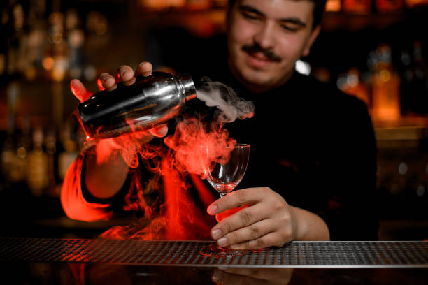 istock Bartender with shaker prepares an alcohol cocktail 1158971403