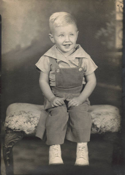 Vintage photograph portrait. Antique. Little boy. 1940s era. Studio vintage, antique portrait of a two-year-old boy. Photo taken in 1944. animal body photos stock pictures, royalty-free photos & images