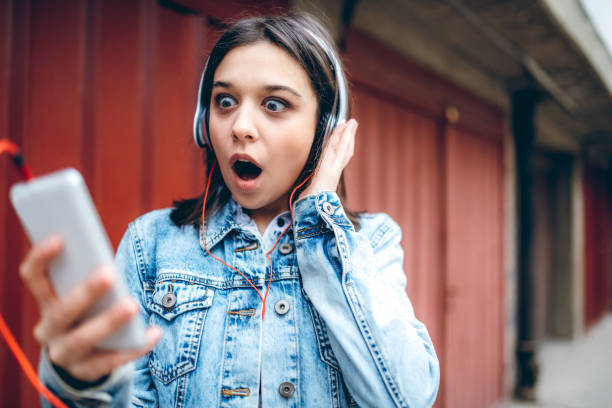 istock Using phone and listening to music 1158977791
