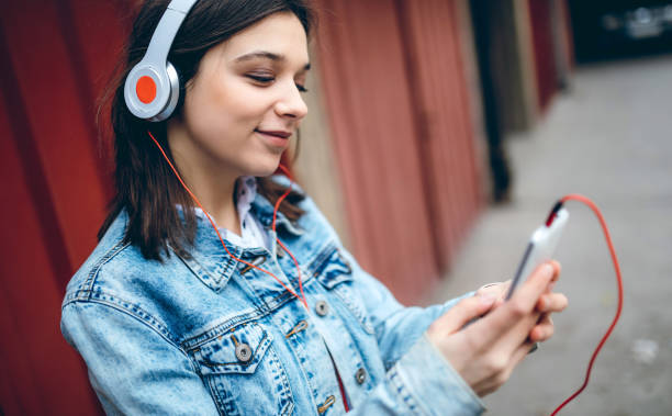 istock Using phone and listening to music 1158977798