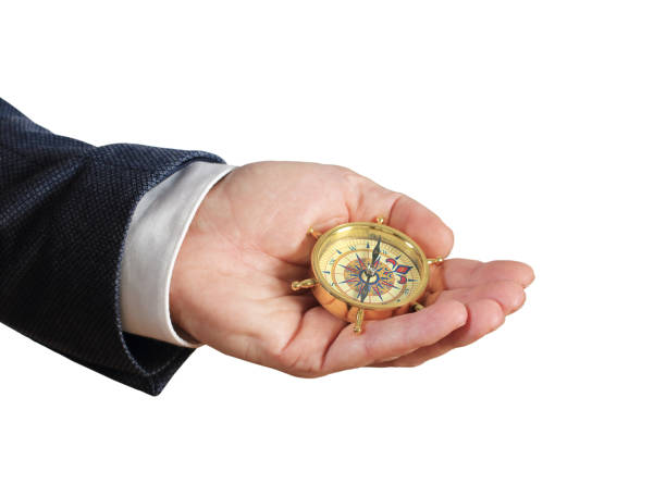 istock Businessman with a compass holding in hand 1158980918