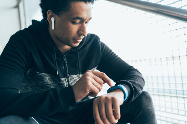 istock Sportsman checking his smart watch 1158981981