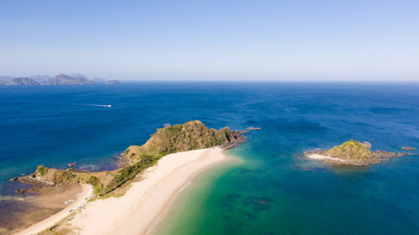 istock Tropical beach with white sand and turquoise lagoon 1158983542