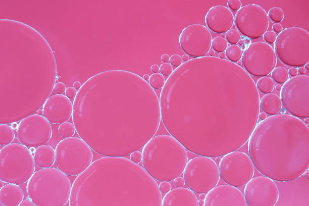 istock Water and oil bubbles - soapy pink bubbles 1158984779