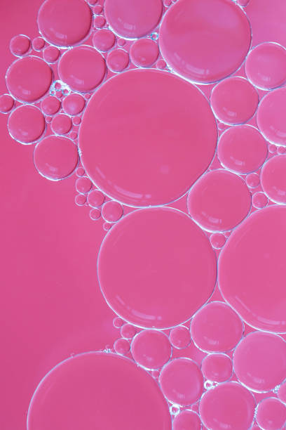 istock Water and oil bubbles - soapy pink bubbles 1158984891