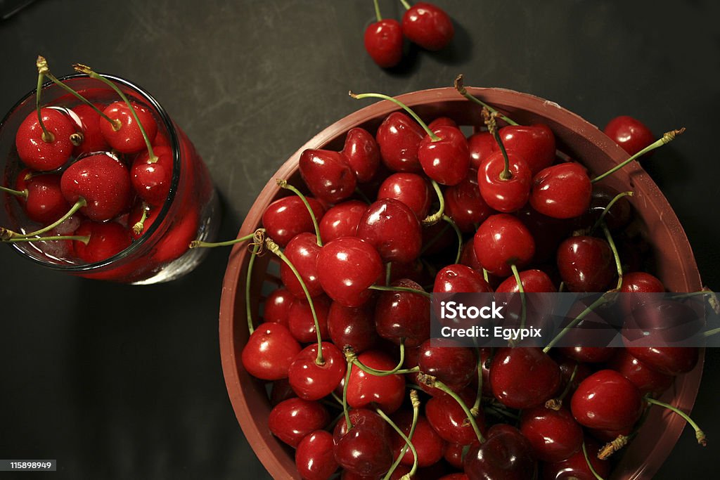 cherries in basket cherries in basket & glass Black Background Stock Photo