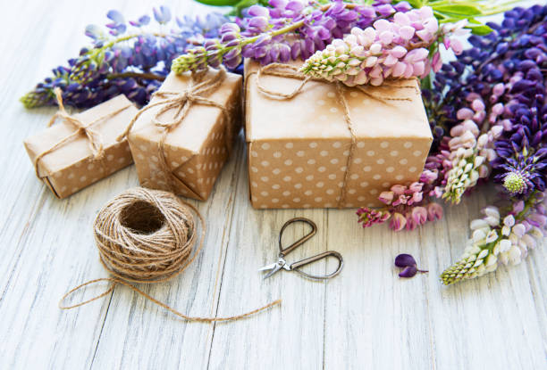 istock Lupine flowers and gift boxes 1158992139