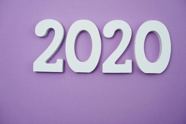 istock 2020 happy new year with space copy on purple background 1158992182
