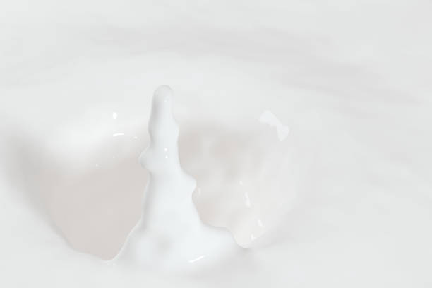 istock Purity splashing milk with creative shapes, 3d rendering. 1158995870